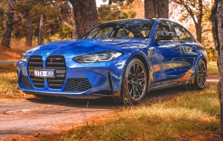 Blue car woods autumn leaves - a blue car free wallpaper