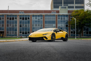 Yellow sports car windowed building - a yellow sports car free wallpaper