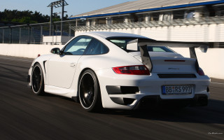 White sports car race track 12 - a white wall behind free wallpaper