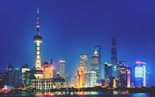 City skyline night river boat - a boat in the foreground free wallpaper