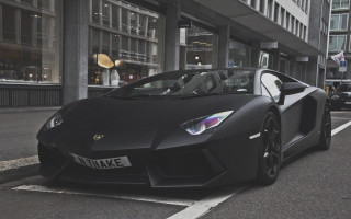 Black sports car road building - the side of the road in front free wallpaper