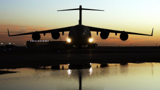 Jetliner sunset backlit mattepainting silhouette - top of an airport tarmac free wallpaper