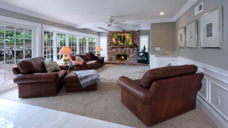 Livingroom fireplace couch chair rug - the floor and a rug free wallpaper