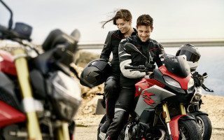 Biker couple motorcycle water bridge - a man and woman free wallpaper