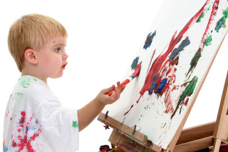Young boy painting blood splatter - a childs free wallpaper