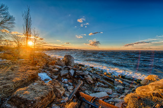 Sunset rocky beach bench shore - a matte painting free wallpaper