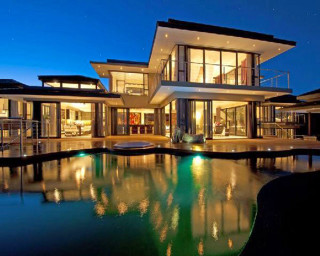 Large house pool nighttime lit - modernism free wallpaper