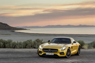 Yellow mercedes sports car ocean 2 - a pink sky free wallpaper