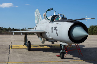 Fighter jet airport tarmac sky - front view free wallpaper