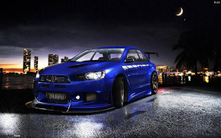 Blue car wet road night - a wet road free wallpaper