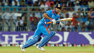 Man blue uniform playing cricket 3 - a crowd watching free wallpaper