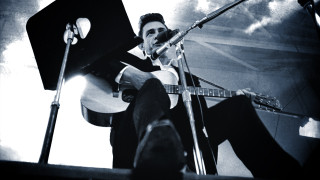 Man sitting stage guitar singing - don eddy free wallpaper