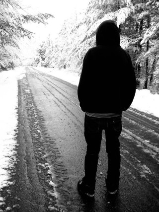 Person snowy road woods backpack - free retro wallpaper