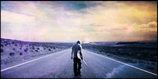 Man skateboarding road cloudy sky - a sunbeam in the background free wallpaper