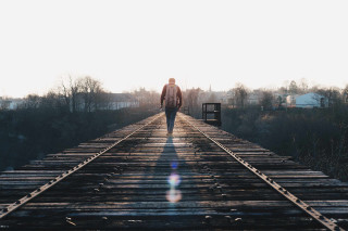 Man walking train track sunshine - the sun free wallpaper