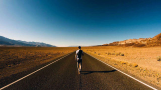 Man desert road mountains background - a blue sky free wallpaper