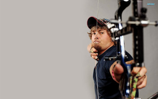 Man holding bow aiming gun - precisionism free wallpaper