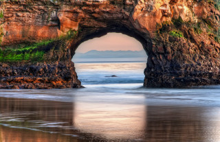 Large rock formation hole beach - a beach near the ocean free wallpaper