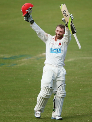 Man holding bat helmet grass 2 - his hands in free wallpaper