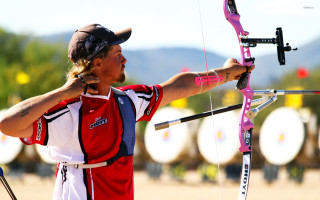 Man holding pink bow arrow 2 - fabien charuau free wallpaper