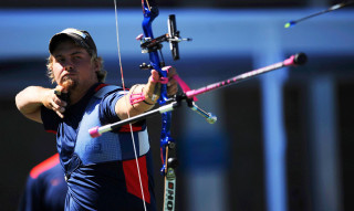 Man holding bow aiming arrow - aaron bohrod free wallpaper