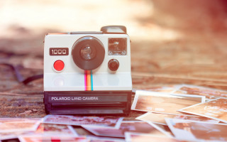 Polaroid camera pile pictures blurry - top of a pile free wallpaper
