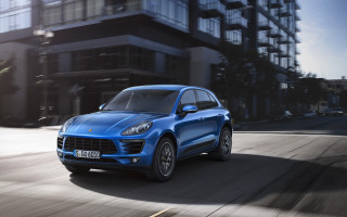 Blue porsche macan city street - a tall building free wallpaper