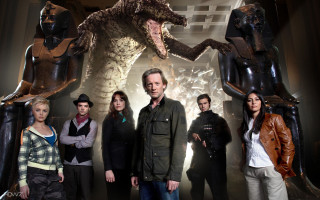 Group people dinosaur statue man - a man in a suit and tie free wallpaper