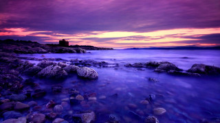 Purple red sky rocky beach - rich moody colour free wallpaper