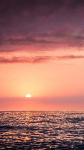 Sunset ocean boat surfboard person - a boat free wallpaper
