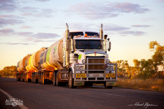 Semi truck sunset light road - a semi truck free wallpaper
