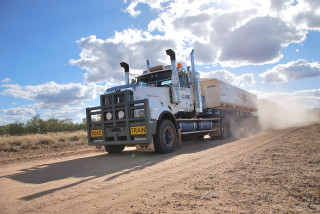 Truck driving dirt road sky - a dirt road free wallpaper