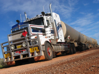 Large truck parked dirt road - a large truck free wallpaper