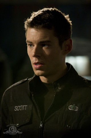 Man black jacket serious look 5 - the camera free wallpaper