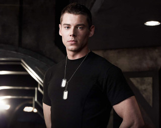 Man black shirt dark room - promotional image free wallpaper