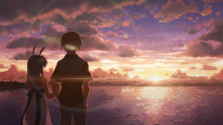 Beach couple sunset ocean clouds 2 - the sun setting behind them free wallpaper