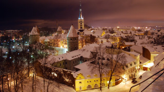 Snowy city nighttime buildings lights - naive free wallpaper