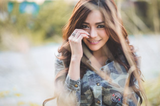 Woman long hair smiling hand 2 - holding free wallpaper
