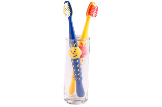 Toothbrushes glass smiley face bottom - a smiley face free wallpaper