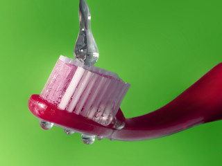 Toothbrush toothpaste scissors green background - a toothbrush free wallpaper