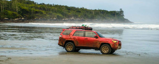 Red suv parked beach water - a body of water free wallpaper for desktop