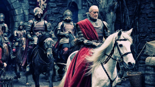 Medieval costumes horses crowd street - a stone building free wallpaper