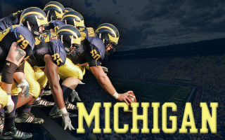 Michigan football team stadium lineup - a stadium in the background free wallpaper