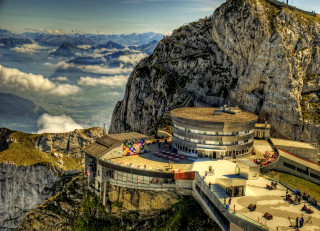 Mountain building sky clouds cliff - zenith view free wallpaper