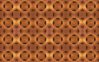 Intricate orange brown circles pattern - a white center free wallpaper