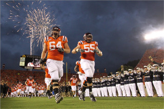 Football players running fireworks crowd - firework free wallpaper