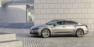 Silver car parked building brick - a silver car free wallpaper