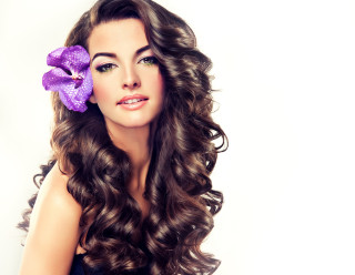 Woman long hair purple flower - flowing hair free wallpaper