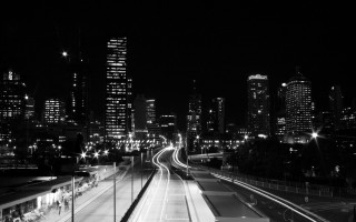 Black white city night train - photo of a city free wallpaper