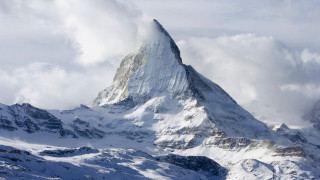 Mountain peak snow covered clouds - andries stock free wallpaper